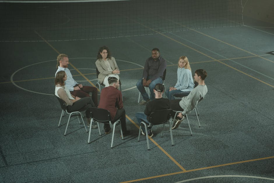 Group of people in a supportive circle session